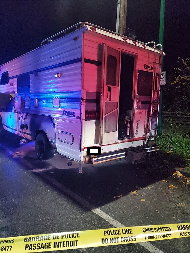 picture of a truck with a camper on the bed
