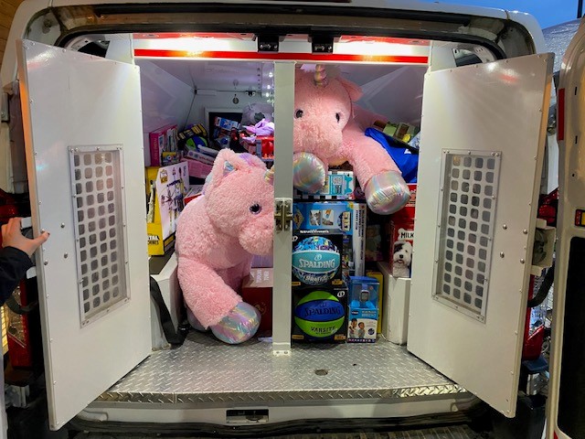 Police van filled with toys