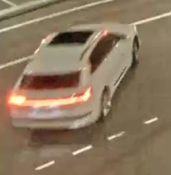 Surveillance camera image of white vehicle 