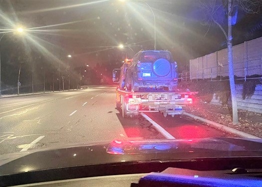 Vehicle being impounded and towed roadside