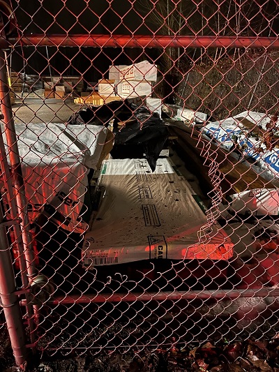 Photo of hole cut in fence
