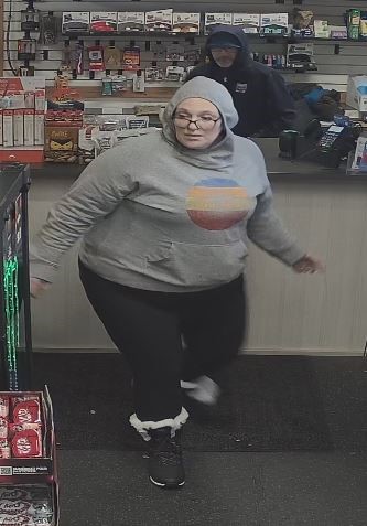 Video surveillance image of female suspect in Trail theft