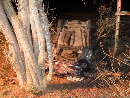 Photo of crashed car on its roof