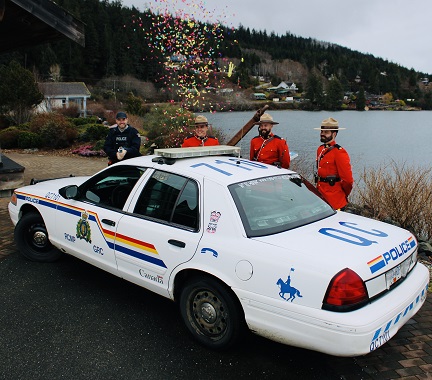 RCMP members with police car